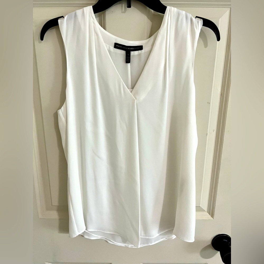 White house black market sleeveless blouse. Never worn white blouse.